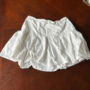 Barley worn white skirt